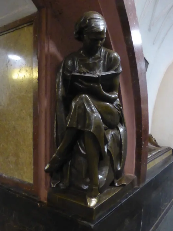 Woman reading a book - touch the shoe for good luck